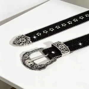 Vintage Western black glitter belt with silver engraved floral buckle and star eyelets.