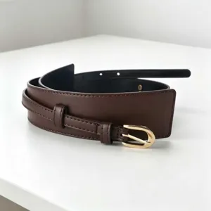 Detailed view of the dark brown wide leather belt, featuring a retro gold buckle and double loop design.