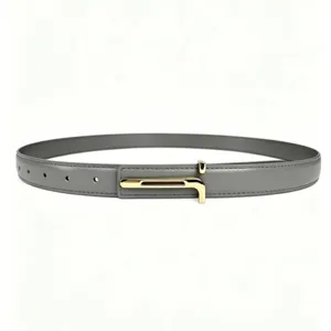 Detailed shot of minimalist gray leather belt with elegant gold metal buckle for women