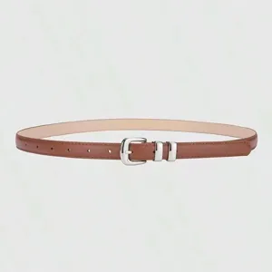 Close-up of a stylish brown women's thin belt with silver metal buckle and loops.