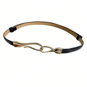 Detailed close-up of the black thin leather belt showing its unique gold-tone abstract hook buckle.