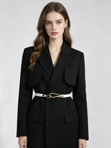 Detail view of white PU leather belt with gold metal buckle worn on black blazer.