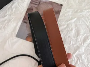 Detailed view of women's leather belt showing texture and stitching. Perfect daily accessory.