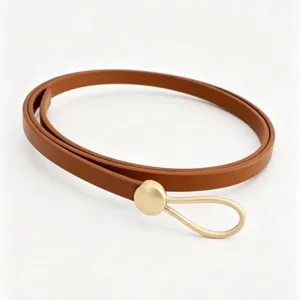 Elegant slim women PU leather belt featuring a minimalist gold drop buckle for dress.