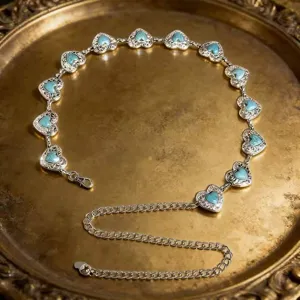 Vintage silver metal waist chain featuring heart-shaped turquoise stone links for women