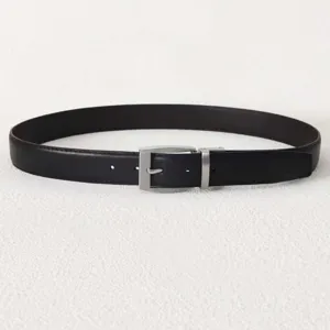 Detail view of a black men's leather belt with a classic silver pin buckle