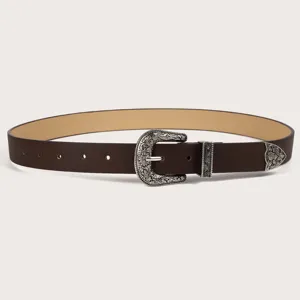 Vintage Western brown belt with ornate silver carved metal buckle for women denim jeans.