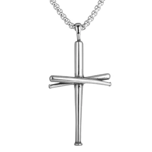 Macro detail of a silver-toned baseball bat cross pendant made from titanium steel
