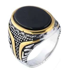 Detailed macro view of a vintage titanium steel ring with black oval gem and rune engravings