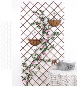Wooden garden fence trellis with artificial flowers and hanging baskets for outdoor home decor.