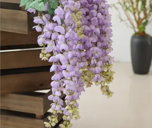 Close-up detail of hanging artificial purple wisteria flowers for wedding decoration