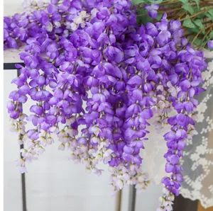 Close-up of vibrant purple artificial wisteria vines with realistic silk petals