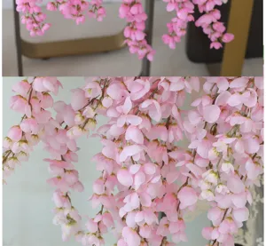 Detailed macro view of pink artificial hanging wisteria silk flowers for wedding decoration