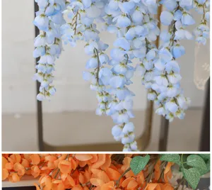 Detailed view of artificial hanging wisteria flowers in blue and orange for wedding decor
