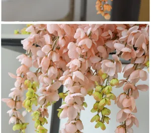 Macro detail of artificial pink wisteria hanging flower vine for wedding decor