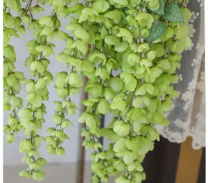 Close-up detail of artificial light green Laburnum hanging flowers for wedding decor
