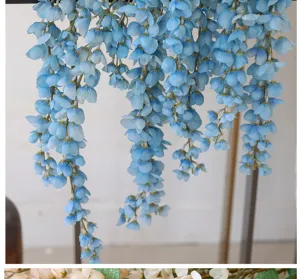Close-up detail of hanging artificial blue wisteria flowers for wedding decoration