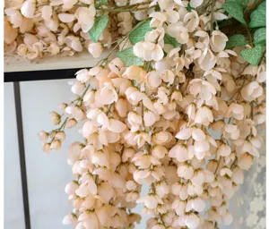 Close-up of artificial wisteria hanging flowers showing delicate silk petals texture