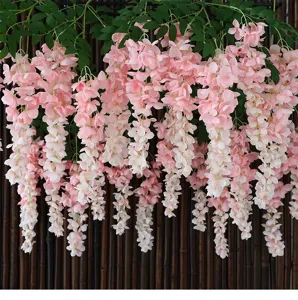 Close-up of pink artificial wisteria hanging flowers for indoor home and wedding decoration