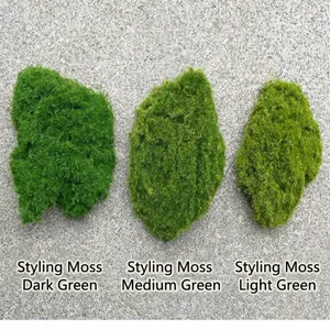 Detailed view of artificial moss blocks in three different shades of green flocking.