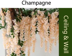 Close-up detail of realistic champagne artificial wisteria flower vines hanging from a wooden trellis