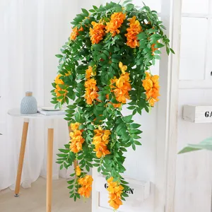 Vivace vite di fiori artificiali pendenti arancioni con foglie verdi per decorazione murale