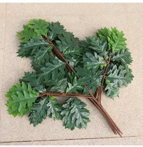 Artificial green leaves branch fake plant foliage for home decor and indoor landscaping