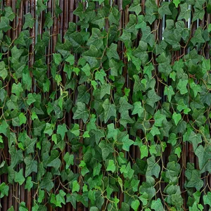 Detailed view of lifelike artificial ivy green leaves for garden wall fence decoration