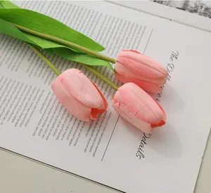 Artificial pink tulip flower bouquet detail, realistic faux floral home decor accent.