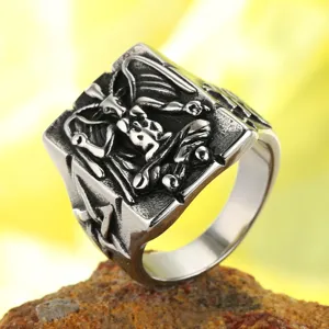 Detailed macro view of an intricate Baphomet carving on a retro stainless steel ring.
