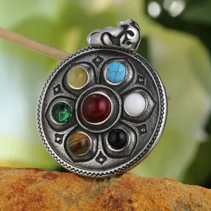 Close-up of vintage Tibetan style titanium steel lotus pendant with seven colorful stones.
