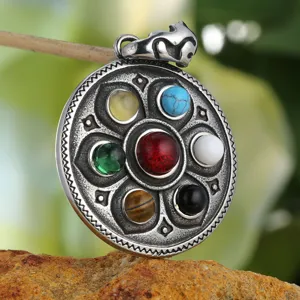 Macro view of vintage Tibetan Lotus pendant with seven colorful gemstones