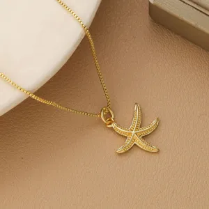 Detailed close-up of golden starfish pendant necklace with elegant box chain