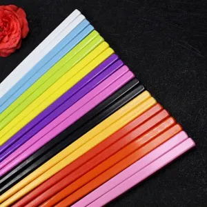 Close-up of vibrant candy-colored melamine chopsticks for children, 18cm long.