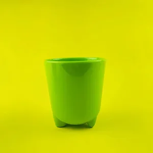 Green tripod cup detail view, cute animal shaped feet design, premium melamine daily drinkware.
