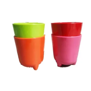Colorful plastic cartoon cups with small feet, cute stacking drinkware set for kids daily.