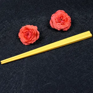 Durable 18cm melamine children's chopsticks in a vibrant earth yellow color finish