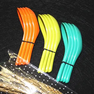 Set of colorful melamine Chinese soup spoons in orange, yellow, and green vibrant colors