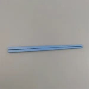 Durable and lightweight light blue 18cm melamine children's chopsticks on gray background