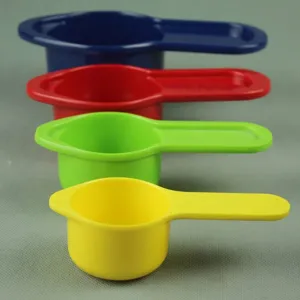 Detailed view of colorful melamine measuring cup set with four different vibrant sizes