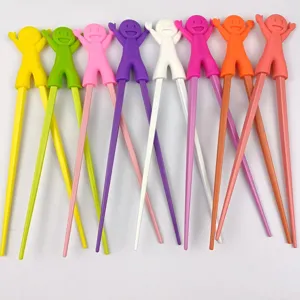 Colorful children training chopsticks with cute silicone doll head, safe and fun toddler tableware.