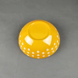 Yellow melamine salad bowl with white polka dots, durable kids tableware for daily use.