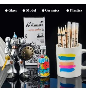 Detailed shot of acrylic paint markers displayed with model, glass bottle and ceramic mug.