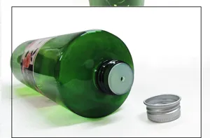Close-up detail of the green aroma essential oil bottle opening, inner stopper and cap.