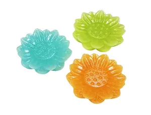 Detailed view of three colorful lotus-shaped resin incense holders in cyan, green and orange