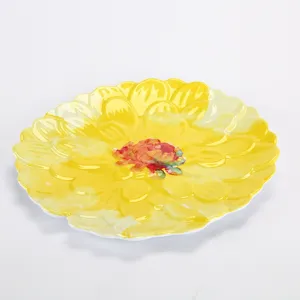 Detail view of a creative yellow flower shaped melamine dinner plate with charming floral design.