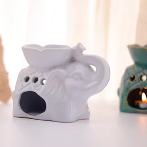 Elegante quemador de aceites esenciales de cerámica blanca con forma de elefante y candelabro