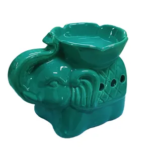 Quemador de aceite cerámico con forma de elefante y cuenco en forma de pétalo.