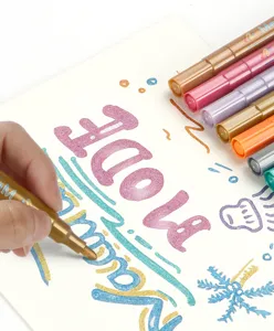 Metallic marker pens detail view showing brilliant shimmer colors and smooth writing on paper surface.