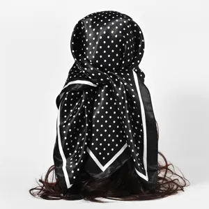 Close-up detail of black and white polka dot satin silk scarf for women 90cm size
